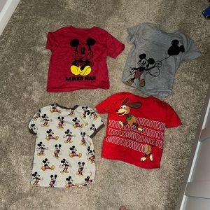 Bundle of four 4T Disney shirts.